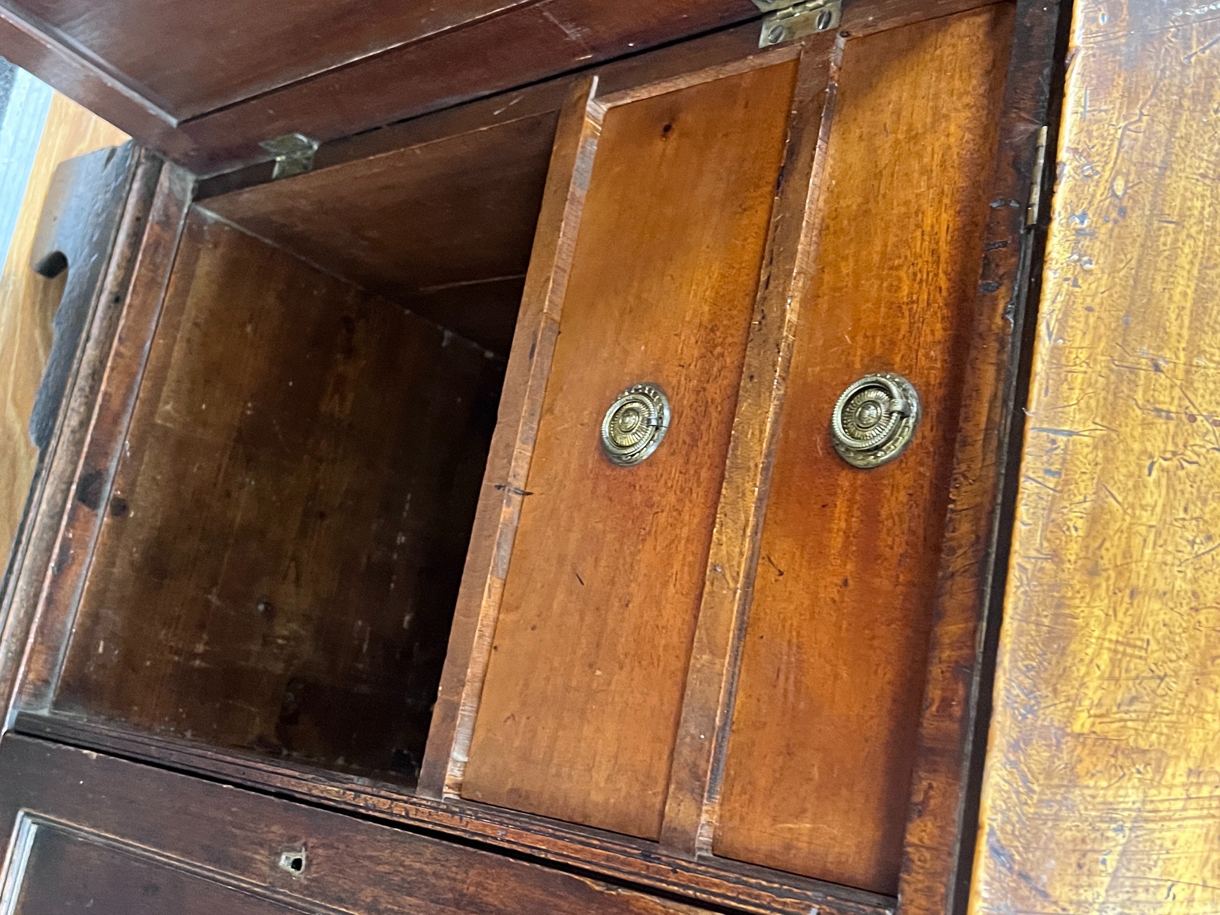 A George III mahogany bureau bookcase of narrow proportions with panelled cupboard base, width 77cm, depth 52cm, height 209cm